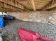 Stone foundation of an A-frame house, with a door, kayaks, and gravel at 120 Ole Point Ln, Salisbury, NC 28146