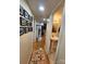 Hallway featuring hard wood floors leading to a powder room, kitchen and living area at 120 Ole Point Ln, Salisbury, NC 28146