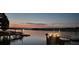 Stunning lake view at dusk with multiple docks and a colorful twilight sky at 120 Ole Point Ln, Salisbury, NC 28146