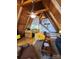 Cozy living area with exposed wooden beams, a kitchen, and a staircase at 120 Ole Point Ln, Salisbury, NC 28146
