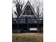 The rear of an A-frame house featuring a patio and an outdoor cooking area at 120 Ole Point Ln, Salisbury, NC 28146
