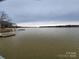 Calm waterfront with a private dock, inviting relaxation and water activities at 120 Ole Point Ln, Salisbury, NC 28146