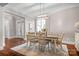 Bright dining room with elegant lighting and hardwood floors at 121 Dabbling Duck Cir, Mooresville, NC 28117