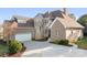 Beautiful brick home with turret, attached garage, and concrete driveway at 121 Dabbling Duck Cir, Mooresville, NC 28117