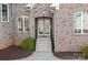 Charming front entrance with double doors and brick facade at 121 Dabbling Duck Cir, Mooresville, NC 28117