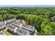 Aerial view showcasing a residential community surrounded by lush green trees at 12312 Landry Renee Pl # 35, Charlotte, NC 28277