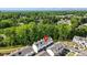 Townhome exteriors surrounded by a lush green landscape at 12312 Landry Renee Pl # 35, Charlotte, NC 28277