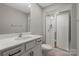 Bathroom featuring a single sink, and a glass-enclosed shower with white subway tile at 12312 Landry Renee Pl # 35, Charlotte, NC 28277