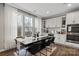 Dining area features a long, dark wood table, seating for six, and bright natural light from the large window at 12312 Landry Renee Pl # 35, Charlotte, NC 28277