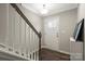 Welcoming entryway features hardwood floors, a stylish staircase, and a modern light fixture at 12312 Landry Renee Pl # 35, Charlotte, NC 28277
