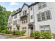 Attractive townhome exteriors with brick and siding, featuring well-maintained landscaping at 12312 Landry Renee Pl # 35, Charlotte, NC 28277