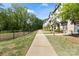 Charming townhouse exteriors are framed by a well-maintained walkway and greenery at 12312 Landry Renee Pl # 35, Charlotte, NC 28277