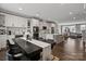 Modern kitchen with stainless steel appliances, a large island and open concept living area at 12312 Landry Renee Pl # 35, Charlotte, NC 28277