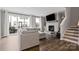 Bright living room with a fireplace, built-in shelves, hardwood floors, and comfortable seating at 12312 Landry Renee Pl # 35, Charlotte, NC 28277