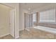 This bathroom has a separate shower, soaking tub, and tile flooring at 12724 Hunting Birds Ln, Charlotte, NC 28278