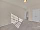 Bright bedroom featuring neutral carpet, ample natural light, and a double door closet at 12724 Hunting Birds Ln, Charlotte, NC 28278