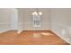 Bright dining room showcasing hardwood floors and elegant trim work at 12724 Hunting Birds Ln, Charlotte, NC 28278