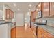 This kitchen boasts granite countertops, stainless steel appliances, and sleek wood cabinets at 12724 Hunting Birds Ln, Charlotte, NC 28278