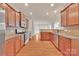 This kitchen features stainless appliances, granite countertops and generous wood cabinets at 12724 Hunting Birds Ln, Charlotte, NC 28278