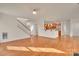 Spacious living area seamlessly connects to kitchen with hardwood floors at 12724 Hunting Birds Ln, Charlotte, NC 28278