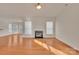 Bright living room featuring a fireplace and an open floor plan at 12724 Hunting Birds Ln, Charlotte, NC 28278
