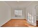 Home office with hardwood floors, natural light, and French door at 12724 Hunting Birds Ln, Charlotte, NC 28278