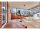 View of the home's covered back porch with brick elements and access to backyard at 1407 17Th Ne Ave, Hickory, NC 28601