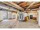 Unfinished basement with exposed ceiling pipes, concrete floor, and a utility area at 1407 17Th Ne Ave, Hickory, NC 28601