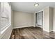 Bright bedroom featuring hardwood floors, natural light, and closet with built in shelves at 1407 17Th Ne Ave, Hickory, NC 28601