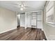 Bedroom with hardwood floors, closet with built-in shelves, and natural light from a window at 1407 17Th Ne Ave, Hickory, NC 28601