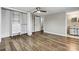 Bedroom features wood floors, closet, ceiling fan, and entry to a full bathroom at 1407 17Th Ne Ave, Hickory, NC 28601