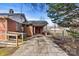 Brick home featuring a long driveway leading to a covered carport and backyard access at 1407 17Th Ne Ave, Hickory, NC 28601
