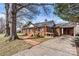 Charming brick home featuring a covered porch, convenient carport, and inviting brick walkway at 1407 17Th Ne Ave, Hickory, NC 28601