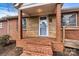 Charming covered porch with brick columns and a textured stone and brick facade at 1407 17Th Ne Ave, Hickory, NC 28601