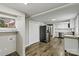 Open kitchen view showing stainless steel refrigerator and white cabinetry at 1407 17Th Ne Ave, Hickory, NC 28601
