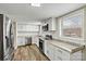 Bright kitchen with white cabinets, stainless steel appliances, and granite countertops at 1407 17Th Ne Ave, Hickory, NC 28601