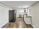 Spacious kitchen featuring stainless steel appliances and modern white cabinetry at 1407 17Th Ne Ave, Hickory, NC 28601
