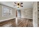 Living room with hardwood floors, a ceiling fan, and neutral paint with an open door at 1407 17Th Ne Ave, Hickory, NC 28601