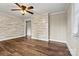 Living room featuring hardwood floors and neutral walls with white trim and access to kitchen at 1407 17Th Ne Ave, Hickory, NC 28601