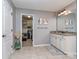 Traditional bathroom features a granite-topped vanity, framed mirror and access to a walk-in closet at 1708 Royal Gorge Ave, Charlotte, NC 28210