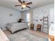Charming bedroom with cute decor, including a ceiling fan, soft colors, and natural light at 1708 Royal Gorge Ave, Charlotte, NC 28210