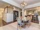 Dining room with modern chandelier that flows to the kitchen area and the stairwell at 1708 Royal Gorge Ave, Charlotte, NC 28210