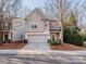 Charming two-story home with a well-maintained lawn, attached garage, and inviting curb appeal at 1708 Royal Gorge Ave, Charlotte, NC 28210