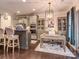 Kitchen with an island, built-in appliances, a nearby desk area and modern finishes at 1708 Royal Gorge Ave, Charlotte, NC 28210