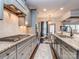Well-equipped kitchen featuring a gas range, granite countertops, and grey cabinetry at 1708 Royal Gorge Ave, Charlotte, NC 28210