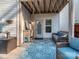 Cozy covered patio with outdoor seating, string lights, and stylish rug for relaxing evenings at 1708 Royal Gorge Ave, Charlotte, NC 28210