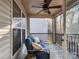 Relax on the cozy porch with a ceiling fan and an outdoor sitting area at 1708 Royal Gorge Ave, Charlotte, NC 28210