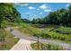 Scenic walking trail with a charming bridge, surrounded by lush greenery and natural beauty at 1708 Royal Gorge Ave, Charlotte, NC 28210