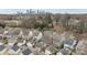 Gorgeous aerial shot of homes in a residential neighborhood and downtown city skyline at 1710 Woodward Ave, Charlotte, NC 28206