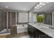 A spacious bathroom features double sinks, a separate shower, and a soaking tub at 1710 Woodward Ave, Charlotte, NC 28206